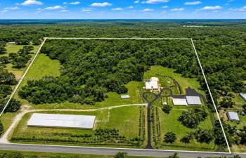 A rare automotive paradise featuring over 100-car capacity across multiple professional-grade structures. From the dedicated paint booth and expansive garage space to the massive commercial facility, this estate offers unmatched opportunities for collectors, enthusiasts, and business owners alike.