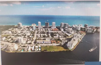 Bayshossre Embassy condominium is pictured in this photo opposite the green empty lot on the Intracoastal waterway