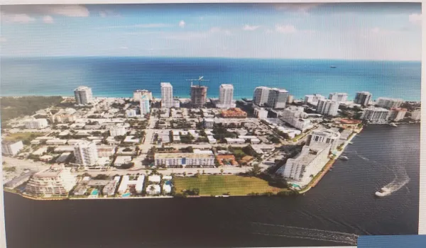 Bayshossre Embassy condominium is pictured in this photo opposite the green empty lot on the Intracoastal waterway