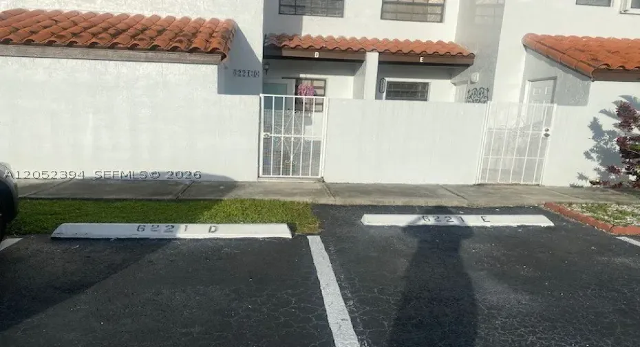 Front with 2 pkng spaces in front