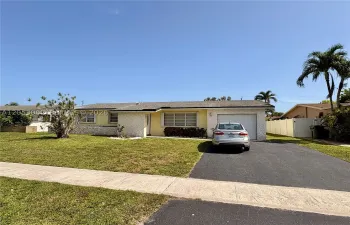 Spacious front yard with expanded driveway