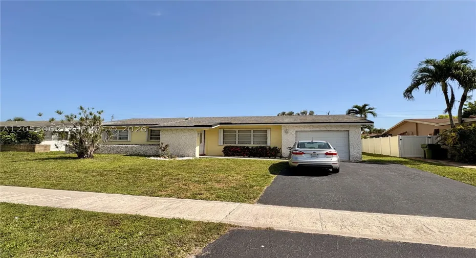 Spacious front yard with expanded driveway