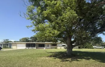 1102 front of house with tree