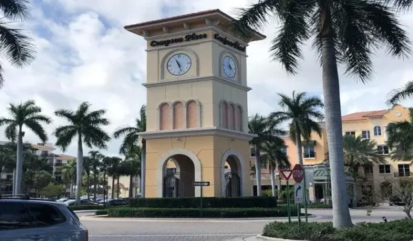 Multi-level clock tower featuring archways and 