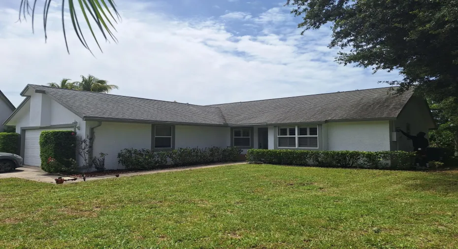 Front of house--repainted in 2025. White with medium green trim.