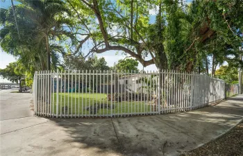 Corner lot which is being sold along with the building next door.