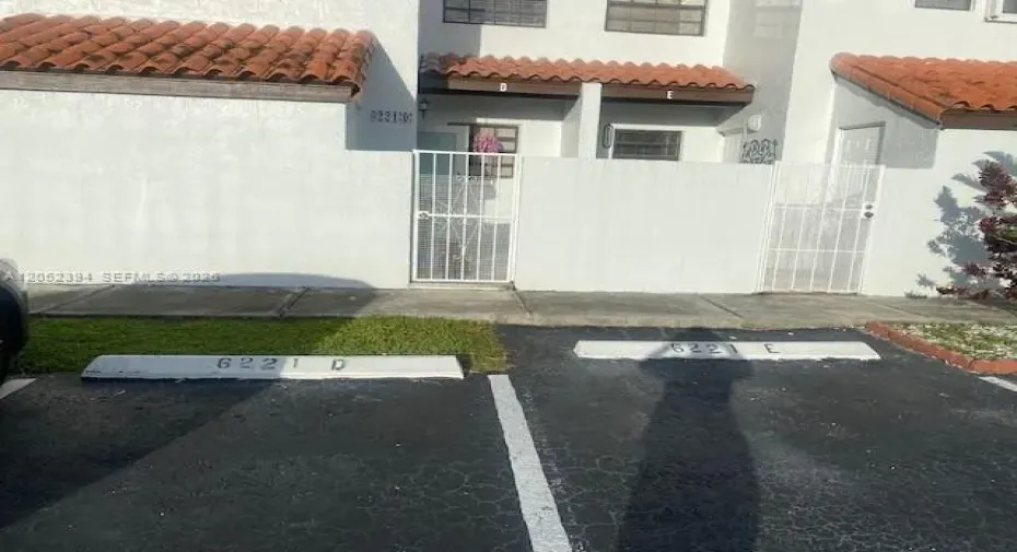 Front with 2 pkng spaces in front