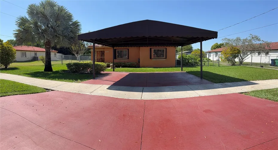 Front of home. Covered Parking