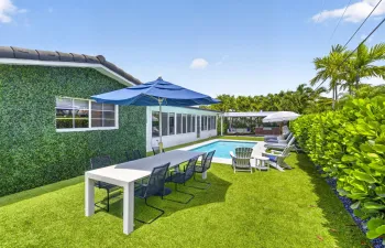 Inviting backyard with pool and summer kitchen!