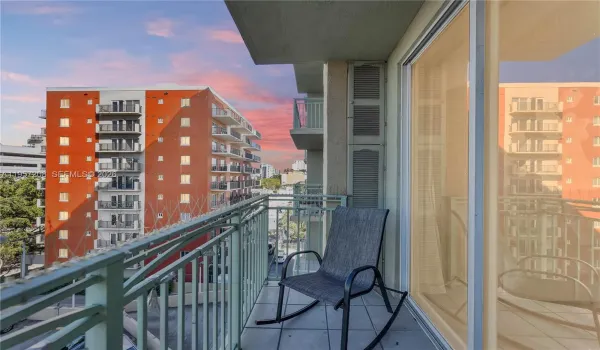 A private balcony offering stunning sunset views of the city skyline — the perfect spot to unwind at the end of the day with the warm South Florida sky as your backdrop.