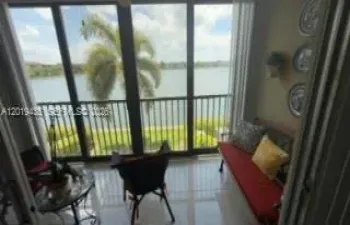 Balcony / Sun Room breathtaking lake views from every direction of the unit for morning coffee, relaxation & privacy