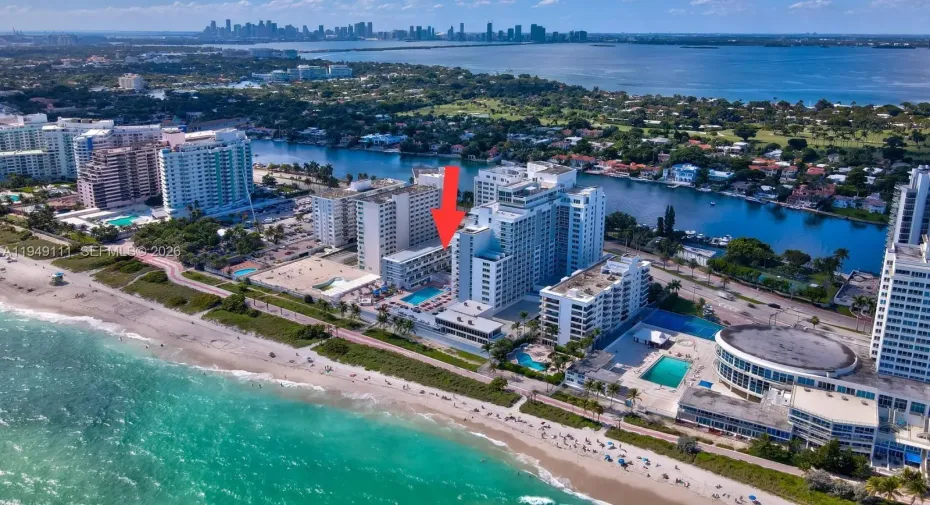 Unit located on top floor of the low-rise building to the left of the pool