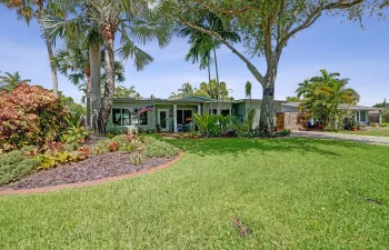 Beautifully updated Coral Heights home featuring a new 2025 roof, hurricane impact windows and doors, timeless architecture, and exceptional curb appeal.