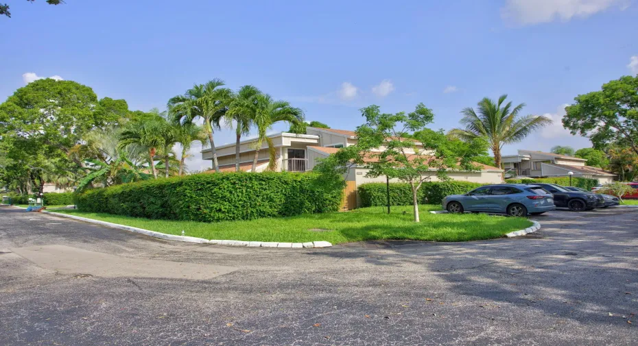 Corner unit with private front gate entry, privacy fencing with privacy hedge and views of the Lago Mar golf course!