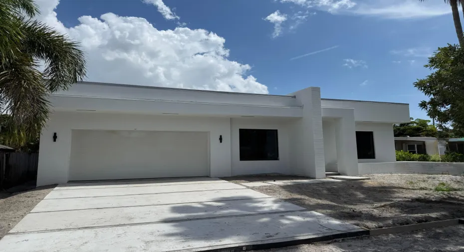 Beautiful Mid-Century Modern Design. Artificial turf will be added between concrete slabs of driveway and sidewalk.