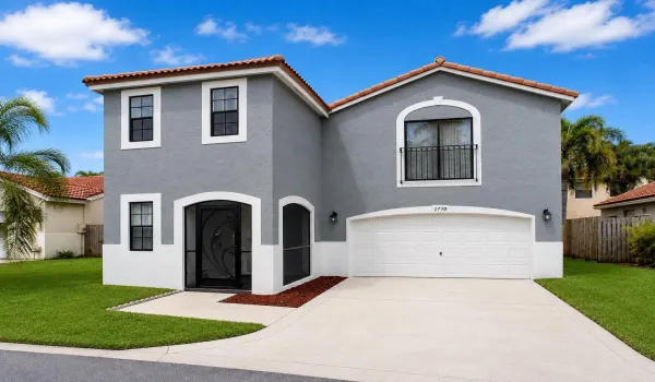 Mediterranean-style exterior featuring a stucco finish, NEW PAINT and terracotta roof tiles