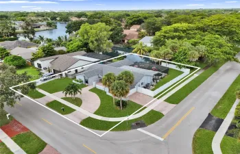 Corner lot wit pool, lake view and two driveways