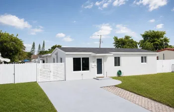 Contemporary single-story residence with a white stucco exterior