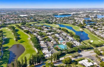 Aerial depiction of a residential community situated alongside a golf course