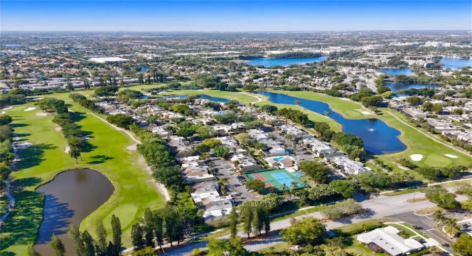 Aerial depiction of a residential community situated alongside a golf course