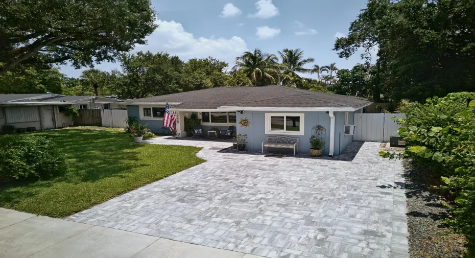 Aerial view of front of home. Nice paver driveway