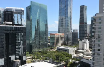 Urban landscape featuring a collection of high-rise buildings with diverse architectural styles
