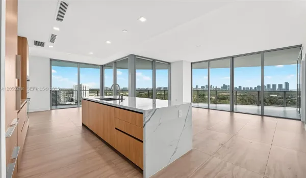 Kitchen and living area with ocean, lagoon and city views
