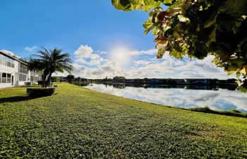 Gorgeous WATER VIEWS! Lovely FIRST FLOOR 2/1.5 Century Village Condo in the Desirable Chatham Section