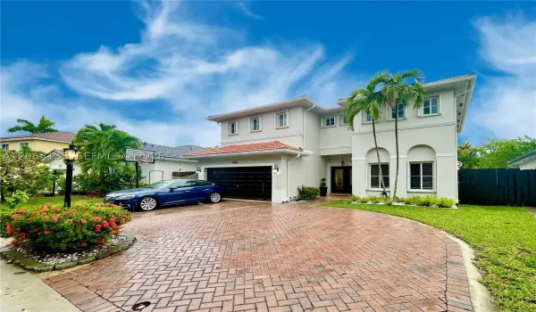 Welcome home to 14121 SW 130th Ave in highly acclaimed Venezia Lakes.