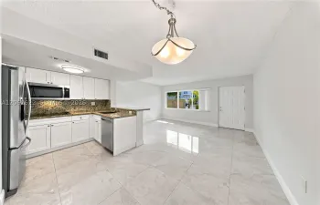 Spacious living and dinning room combo, convenient access to parking right outside the door.Unit backs to a courtyard not a street, excellent for privacy and security.