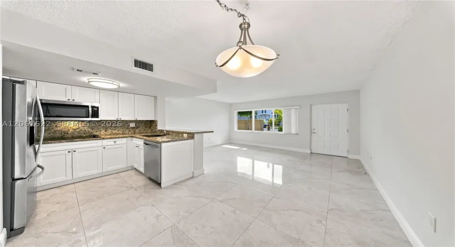 Spacious living and dinning room combo, convenient access to parking right outside the door.Unit backs to a courtyard not a street, excellent for privacy and security.