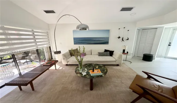 Bright Interiors with Glass Front Door and Openings to Patio