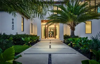 Front Entrance with Elegant Oversized Teak Wood Door