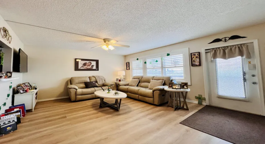 Lovely Living Area with Upgraded Flooring & Designer Window Treatments