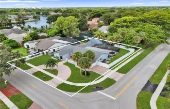 Corner lot wit pool, lake view and two driveways