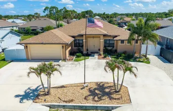 Distinctive curb appeal begins with a circular driveway, impressive entry, and timeless design.