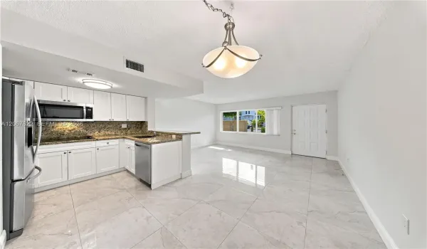 Spacious living and dinning room combo, convenient access to parking right outside the door.Unit backs to a courtyard not a street, excellent for privacy and security.