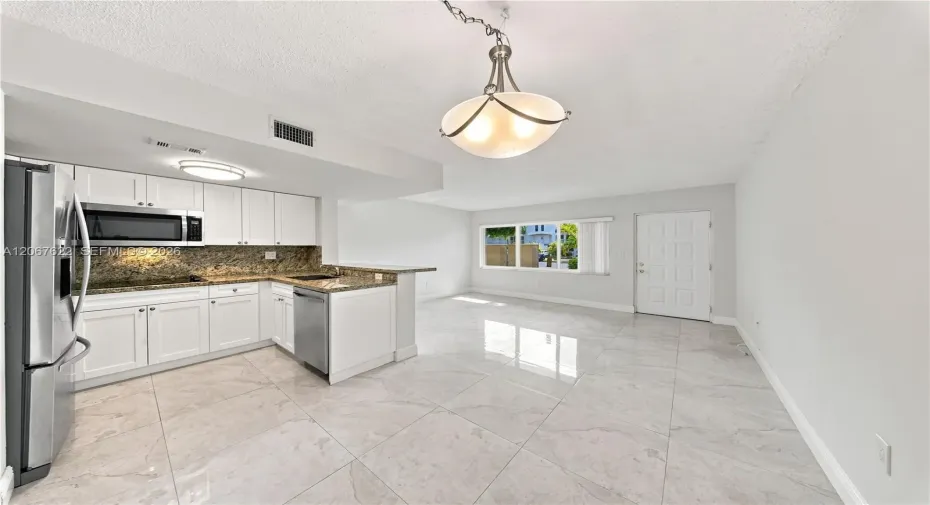 Spacious living and dinning room combo, convenient access to parking right outside the door.Unit backs to a courtyard not a street, excellent for privacy and security.