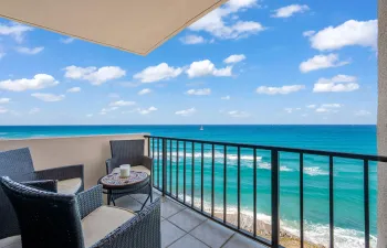 Balcony overlooking the ocean with a black metal railing