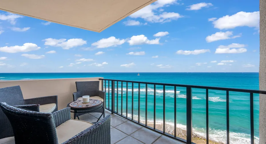 Balcony overlooking the ocean with a black metal railing