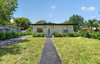 Beautifully renovated property with all new landscaping, long driveway, and a welcoming entrance