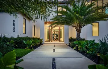 Front Entrance with Elegant Oversized Teak Wood Door