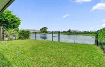 BEAUTIFUL FENCED IN BACK YARD ON WIDE LAKE