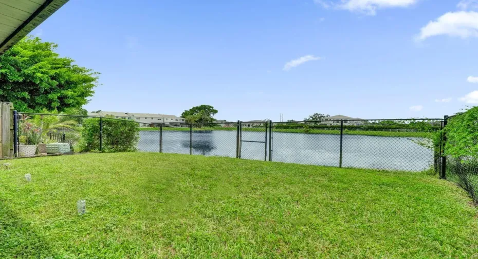 BEAUTIFUL FENCED IN BACK YARD ON WIDE LAKE
