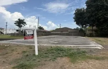 front of vacant land 4th St