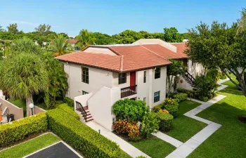 Private 2nd floor corner residence with lake and pool views, steps from the renovated clubhouse.