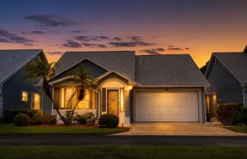 This well-maintained 2-bedroom, 2-bathroom, 2-car garage home offers 1,372 square feet of living space with a comfortable open layout, high ceilings and split-bedroom floor plan. Wood laminate flooring flows through the main living areas, creating a warm and inviting feel.