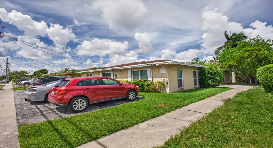 Single-story property with stucco exterior, a concrete driveway, and a concrete pathway