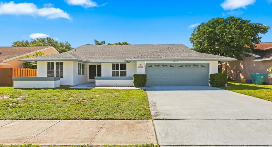 Inviting 4-bedroom, 2-bath home in the gated Stonehaven community, featuring a welcoming front entry, two-car garage, and a new roof installed in 2023.