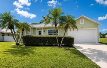 Waterfront living awaits in this single-story Port St. Lucie home. The three-bedroom, two-bath home offers 1,152 square feet of comfortable living space with direct access to the water's edge. NEW Roof, Impact Windows and Sliders throughout, NEW A/C, Water Heater (2023) Plus Newly Renovated Bathrooms!!! Great location with a fenced backyard and extra space between you and your neighbors. Conveniently located just minutes from I-95 and the Turnpike on the south side of Port Saint Lucie. NO HOA.